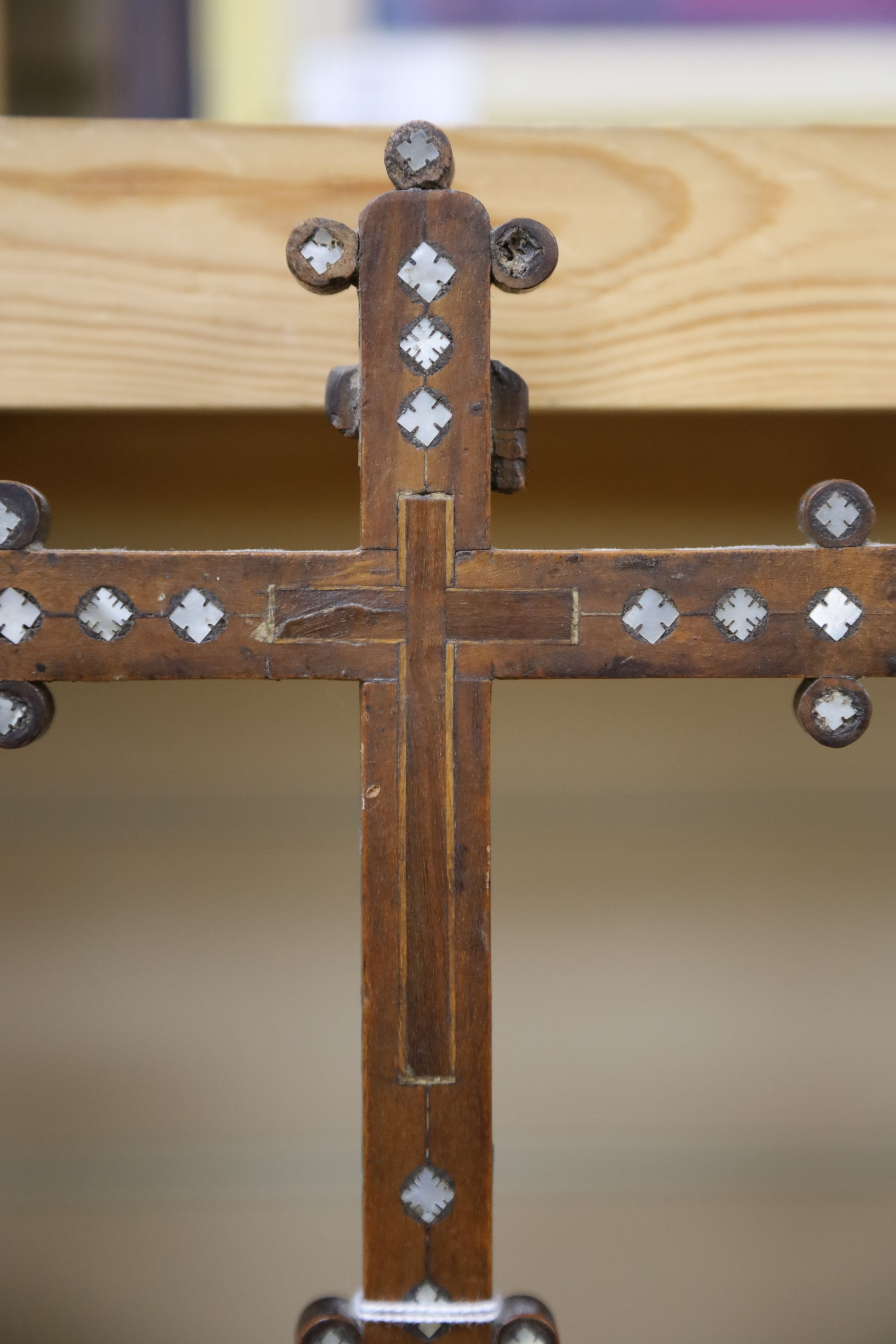 A 19th century Continental fruitwood crucifix with mother of pearl inlay, H 36cm